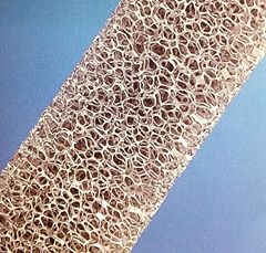 Metallic porous material filter